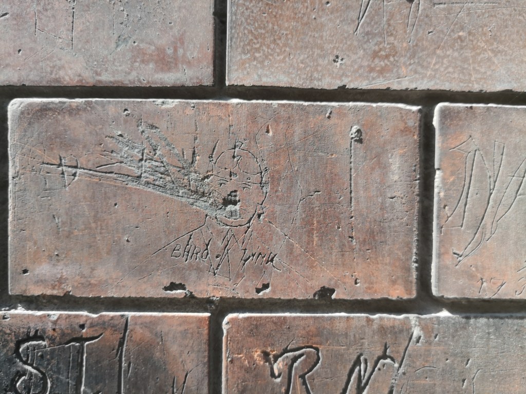 Historical graffiti on a wall of Homok utca