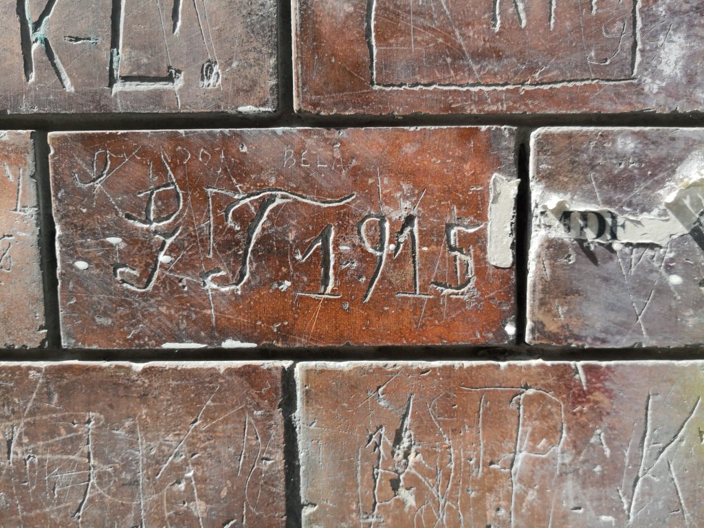 Historical graffiti on a wall of Homok utca