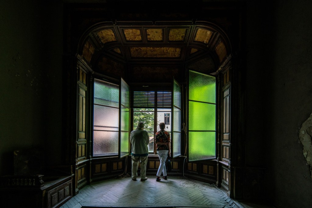 Interior of an abandoned mansion in Budapest with old windows