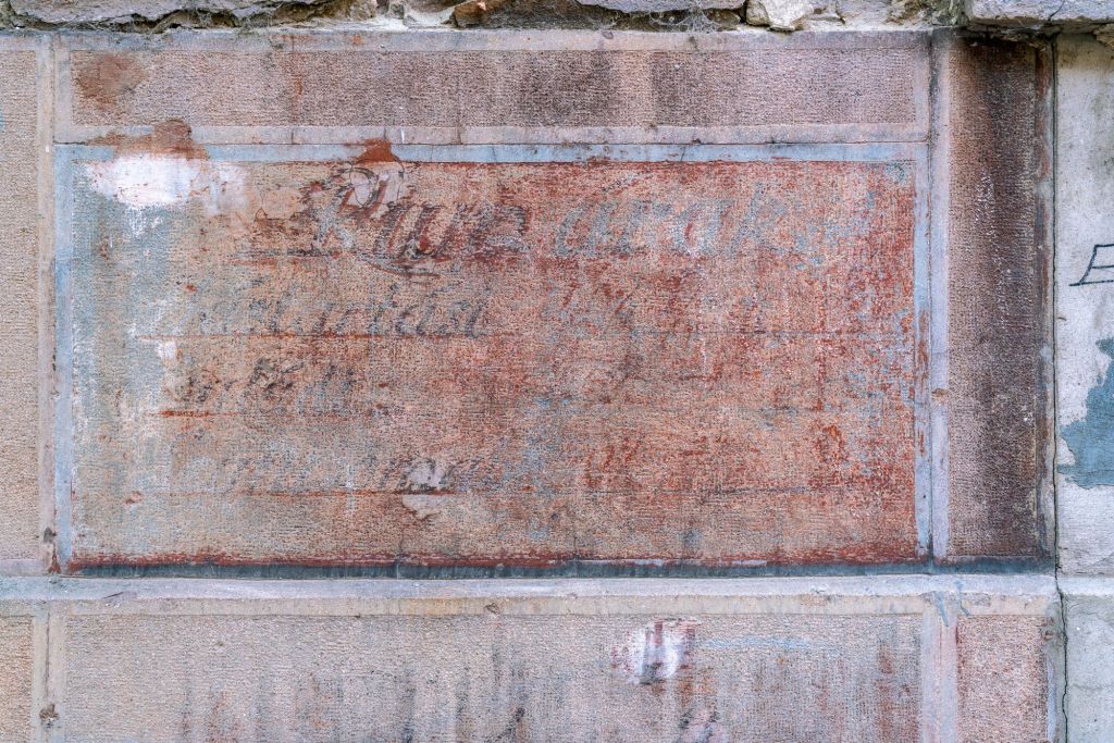 Old sign for an alcoholic beverage store in Budapest