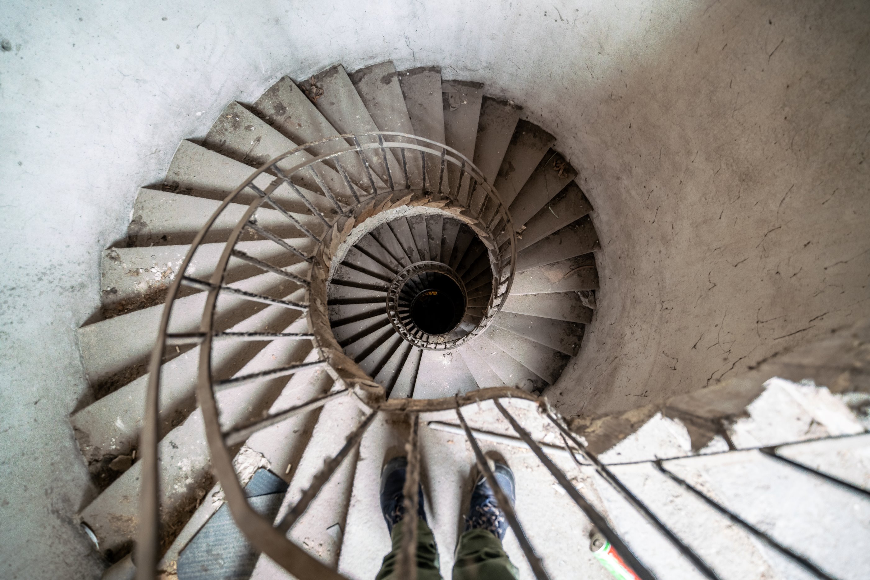 Spiral staircase in a 19th-century decaying old house in the center of Budapest.