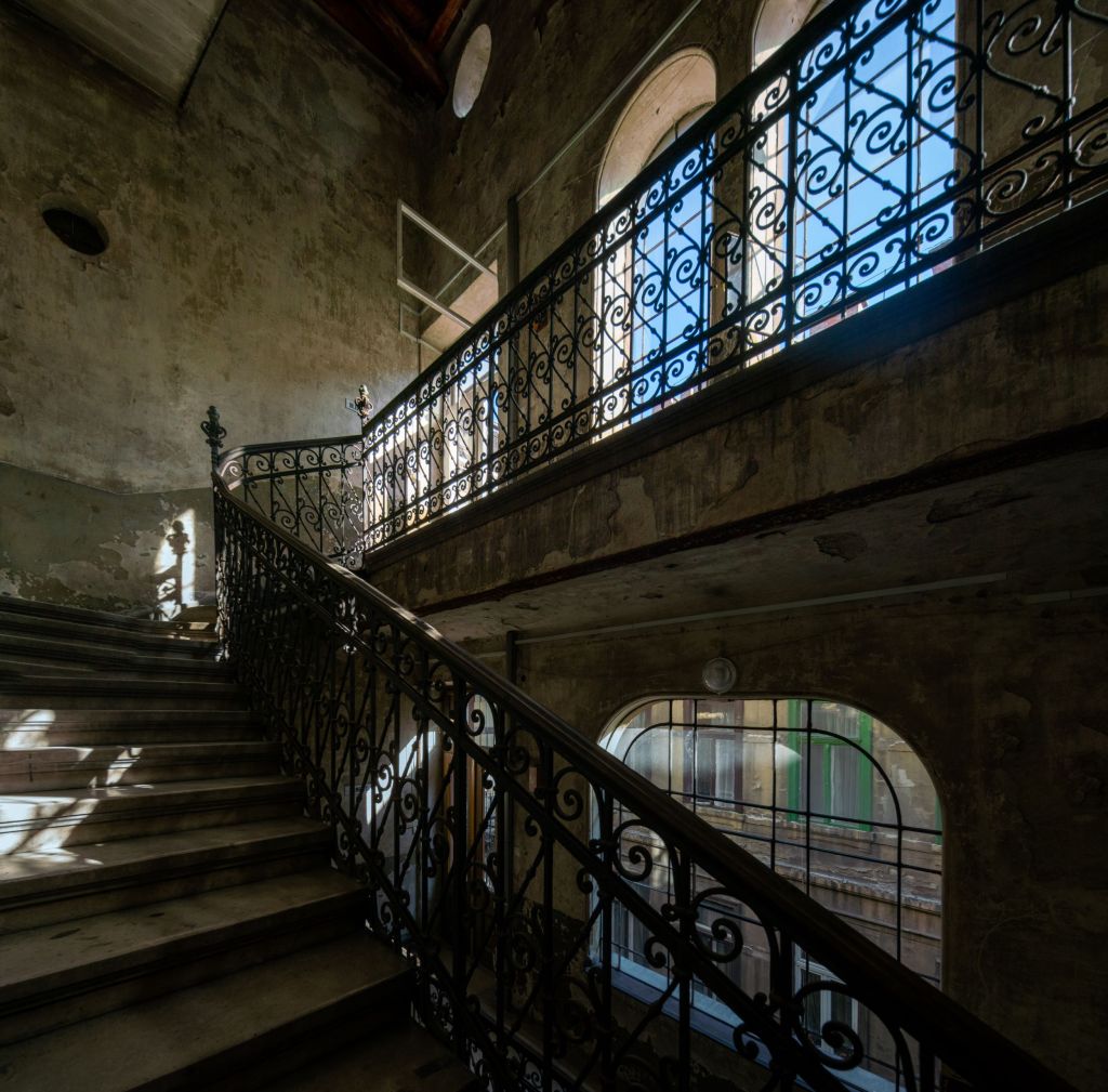 Staircase of a decaying building in Budapest designed by the famous architect Lipót Baumhorn