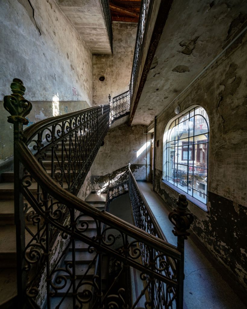 Staircase of a decaying building in Budapest designed by the famous architect Lipót Baumhorn