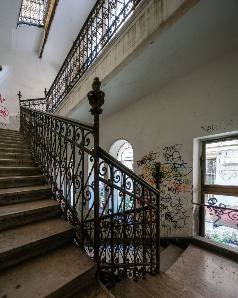 Staircase of a decaying building in Budapest designed by the famous architect Lipót Baumhorn
