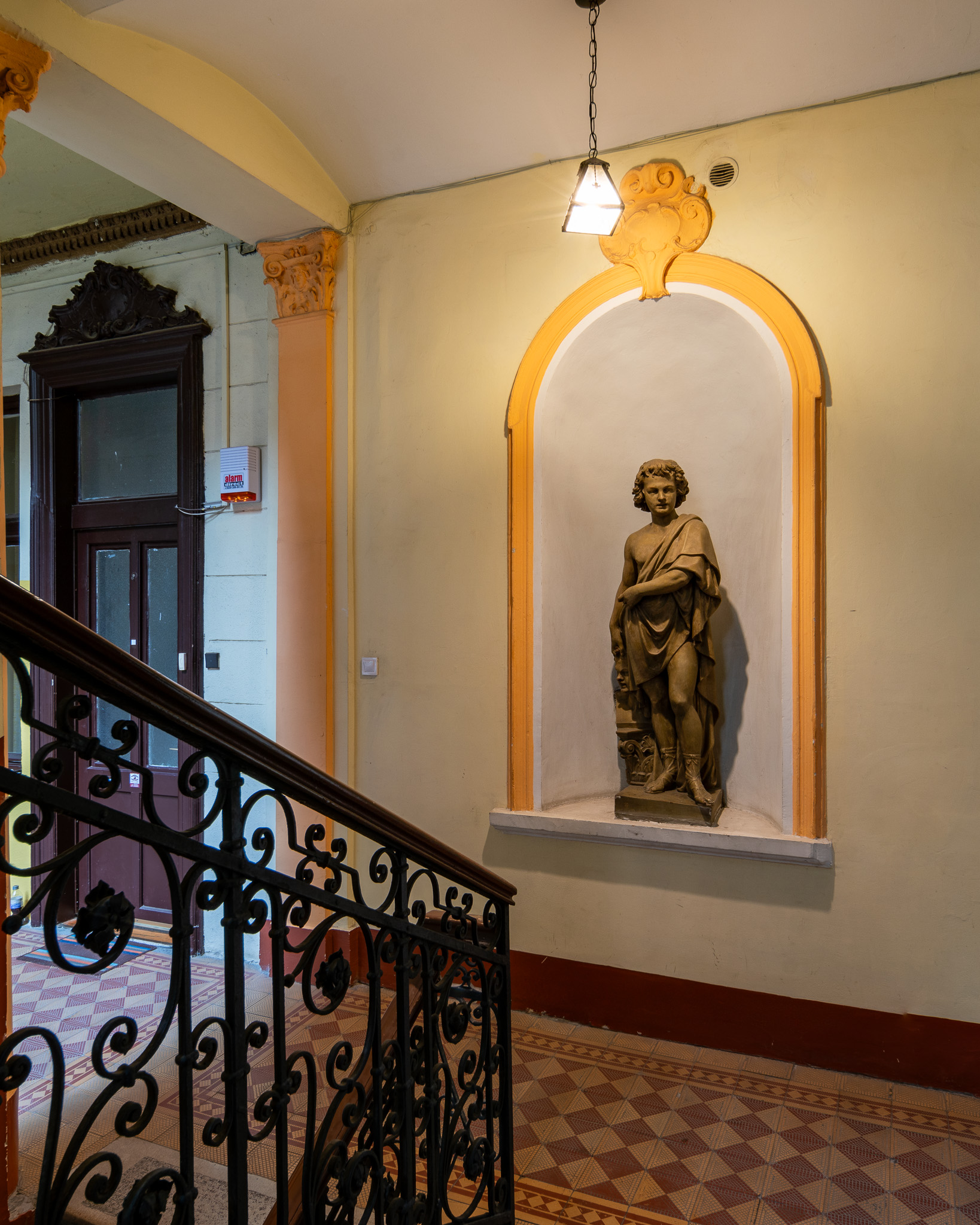 Statue in the staircase of Visegrádi utca 4, an old building in the 13th district of Budapest