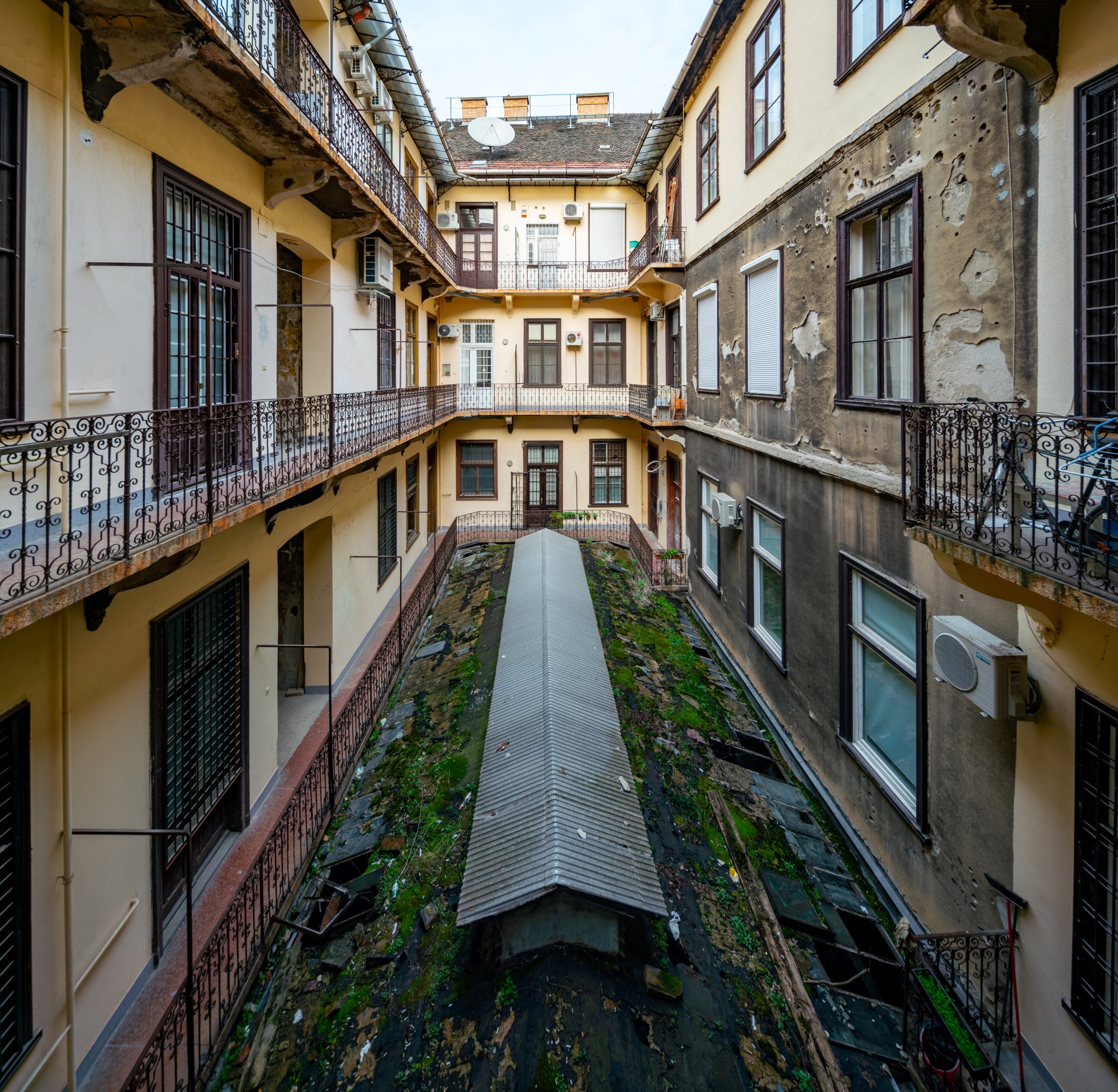 The abandoned courtyard of Paulay Ede utca 25-27 in Budapest. This residential building from 1890 is known as the "Üveg-Udvar" - "Glass Courtyard".